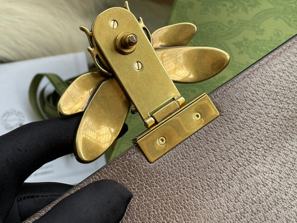 BORSA A MANO GG MINI 25 IN TELA BEIGE E PELLE DI VITELLO MARRONE