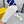 FENDI GRAPHY LOGO LETTERING SLIDES IN WHITE LAMBSKIN WITH GOLD HARDWARE