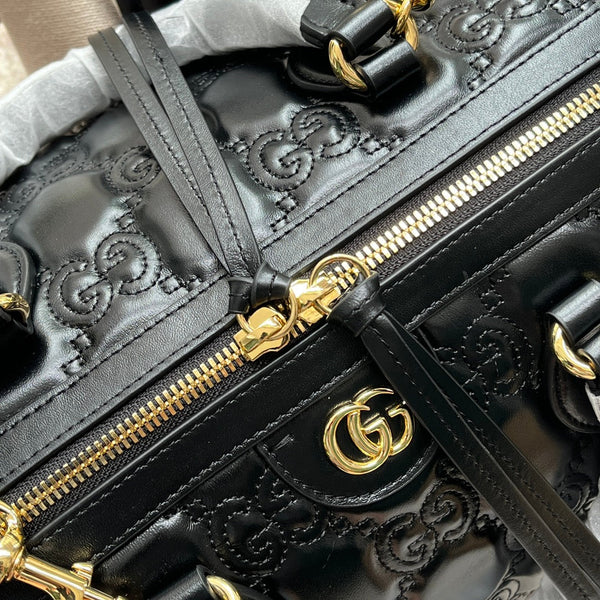 BORSA A MANO MATELASSÉ 31 IN PELLE DI VITELLO GOFFRATA NERA E FERRAMENTA ORO