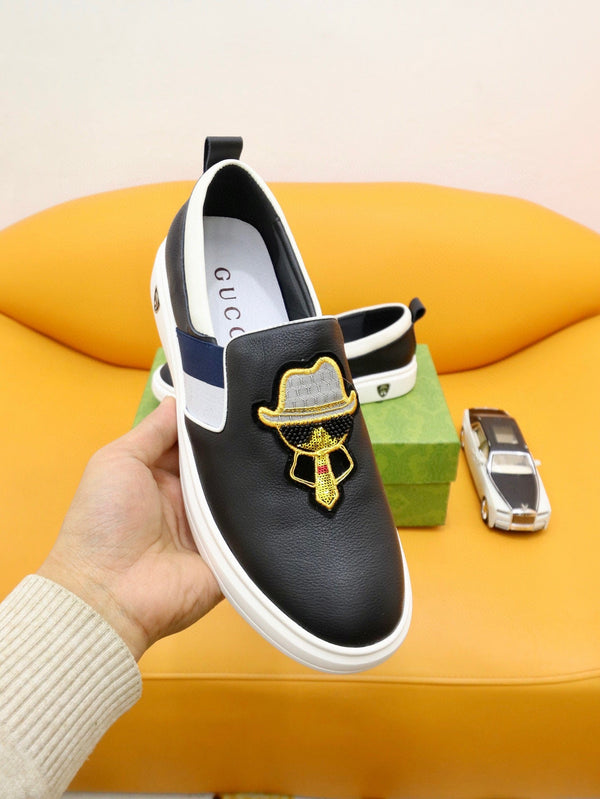 Mocassini slip-on da uomo GG in pelle di vacchetta bianca e nera 660094