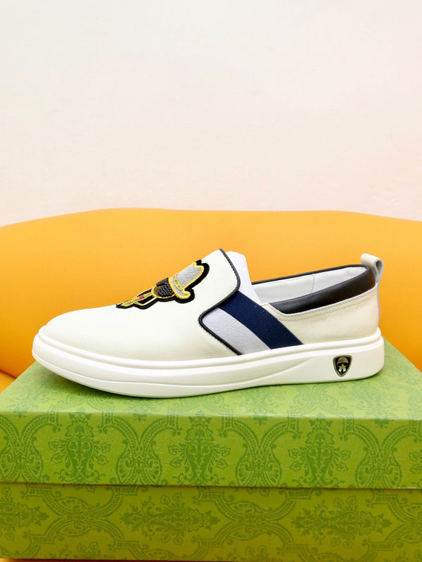 Mocassini slip-on da uomo GG in pelle di vacchetta bianca e nera 660094