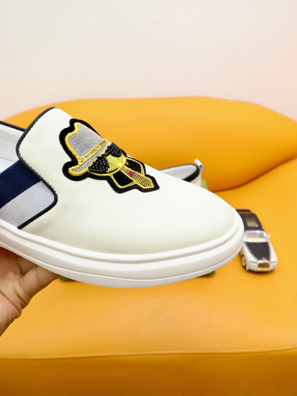 Mocassini slip-on da uomo GG in pelle di vacchetta bianca e nera 660094