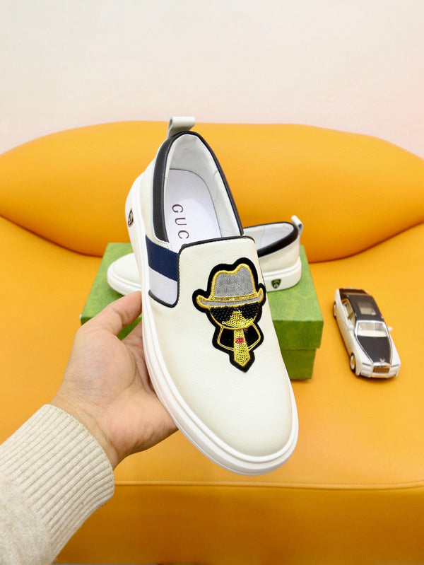 Mocassini slip-on da uomo GG in pelle di vacchetta bianca e nera 660094