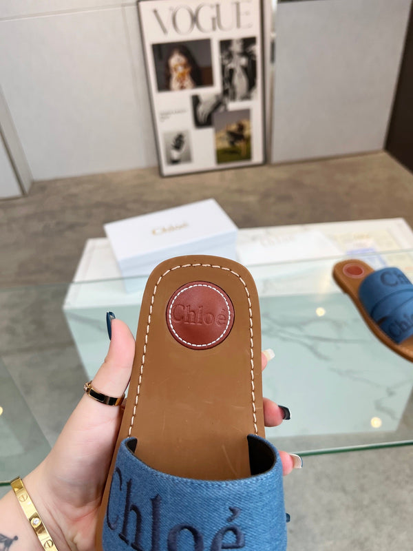 CHLOÉ WOODY MULE IN COBALT BLUE DENIM WITH EMBROIDERED LOGO