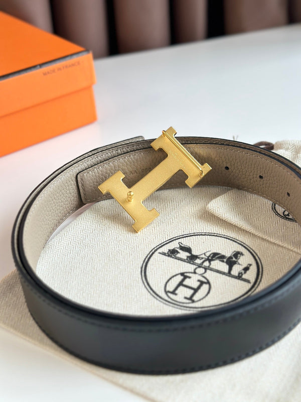 Cintura reversibile con fibbia H in oro HM da 32 mm, in pelle nera e beige 124654