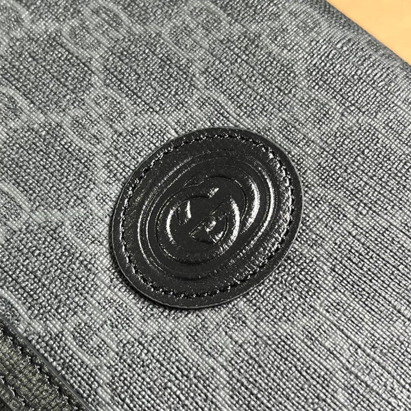 POCHETTE CON CHIUSURA GG 20 IN TELA NERA E PELLE DI VITELLO