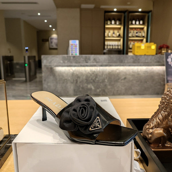 Prad 26s Open Toe Mules 45mm In Black Patent Calfskin With Rosette