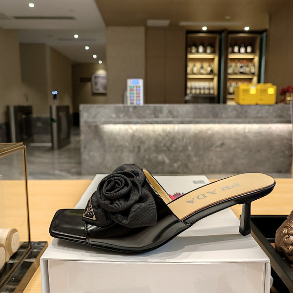 Prad 26s Open Toe Mules 45mm In Black Patent Calfskin With Rosette