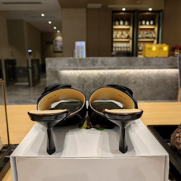 Prad 26s Open Toe Mules 45mm In Black Patent Calfskin With Rosette