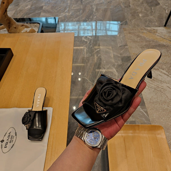 Prad 26s Open Toe Mules 45mm In Black Patent Calfskin With Rosette