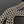 BORSA CRUSH CHAINED 32 IN PELLE DI VITELLO SCHIACCIATA TRAPUNTATA METALLIZZATA ARGENTO
