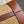 PICCOLO SECCHIELLO CUIR TRIOMPHE 22CM IN TESSUTO A RIGHE E PELLE DI VITELLO TAN