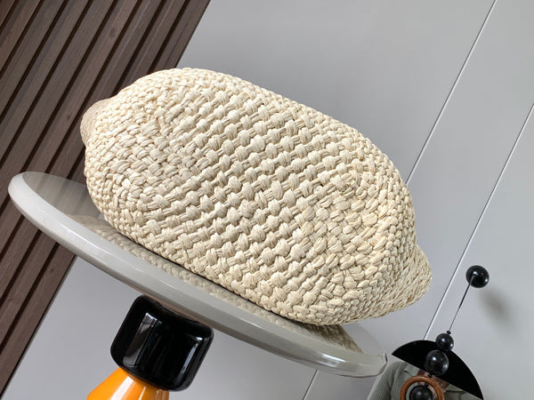 Medium anagram basket bag in iraca palm and calfskin
