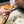 HM FOCUS BUCKLE & REVERSIBLE BLACK AND ORANGE LEATHER STRAP 13MM GOLD HARDWARE