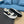 PRA SNEAKER IN WHITE CALFSKIN AND BLACK FABRIC WITH GOLDEN LOGO