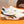 PRA SNEAKER IN WHITE CALFSKIN WITH BLACK AND YELLOW STRIPED