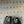 ALAIA FOLDED FLAT MULES WITH SPHERES ON BLACK CALFSKIN