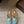 Alaia 25 Infradito Fishnet Flat Mules Lagoon Green Lampskin 303711