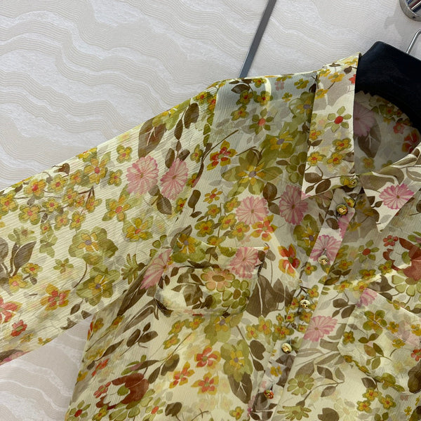 Abito Celine in seta verde con motivo floreale