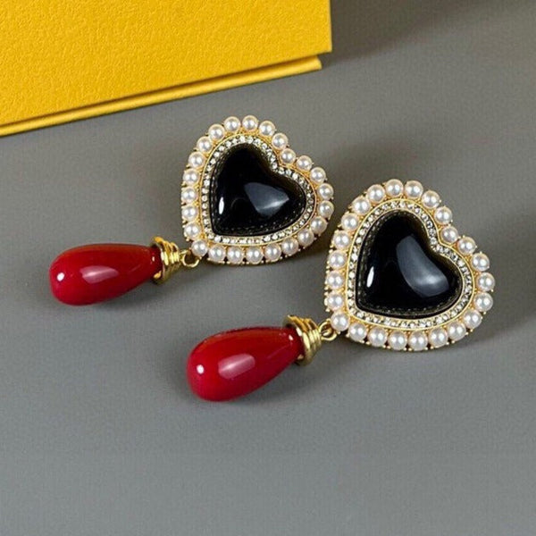 ORECCHINI IN ORO CON PERLA A CUORE F