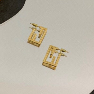 ORECCHINI IN ORO A FORMA DI MOTIVO BAGUETTE FF