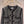 Veste en tweed noir Chanel 2025 à quatre poches et bordure en velours