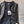 Veste en tweed noir Chanel 2025 à quatre poches et bordure en velours