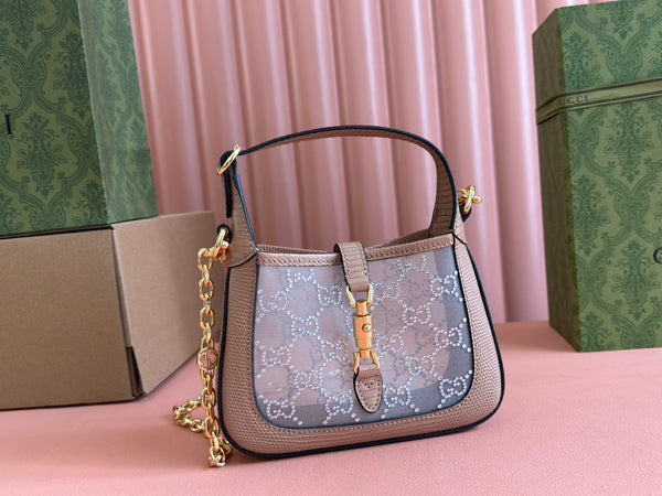 Sac GG Jackie Mini en cuir de lézard rose orné de cristaux 675799