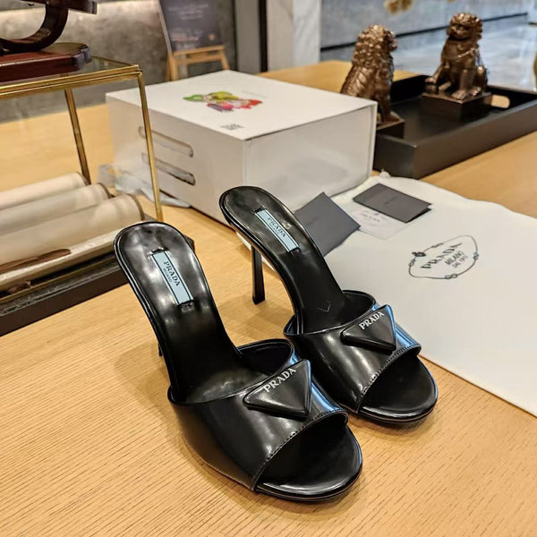 Prad 26s Open Toe Mules 100mm In Black Patent Calfskin With Logo