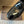 Mules plates Alaia 25 Infradito Fishnet en cuir d'agneau noir 303708