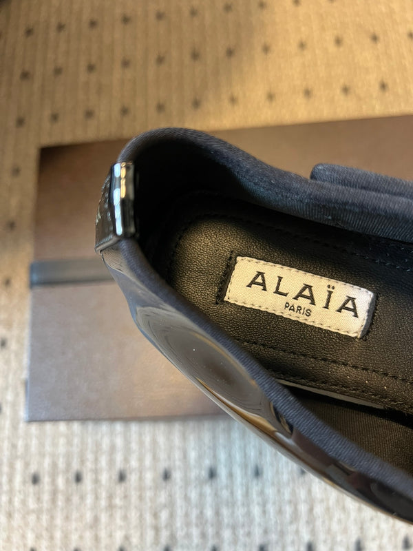 Mules plates Alaia 25 Infradito Fishnet en cuir d'agneau noir 303708