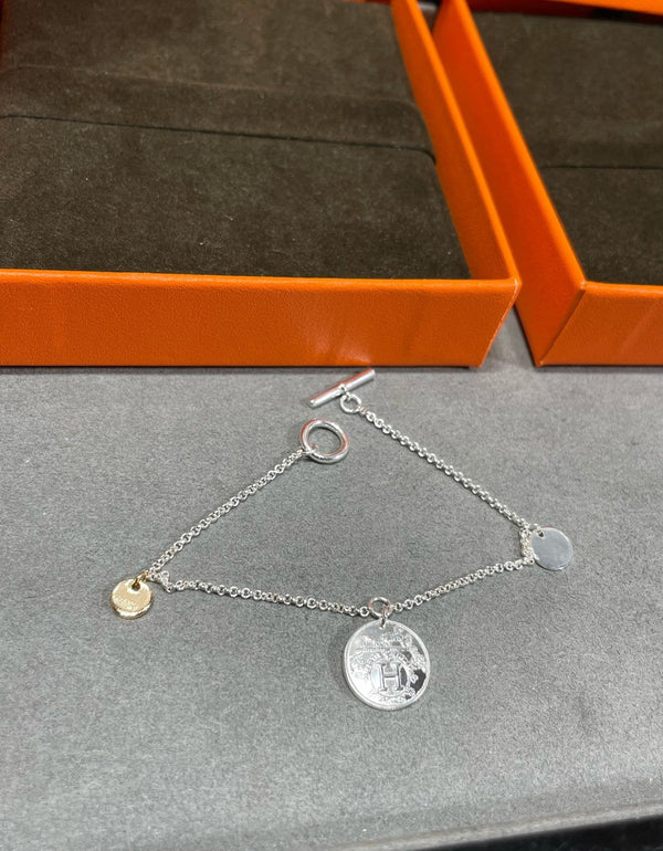 BRACCIALE CON MONETE HM