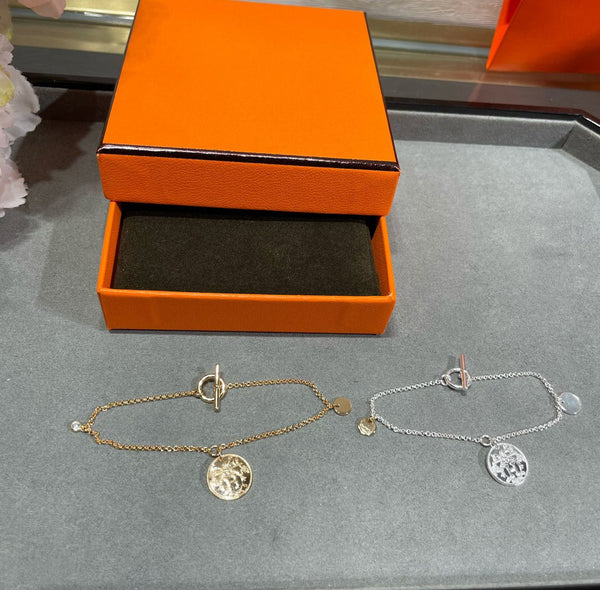 BRACCIALE CON MONETE HM