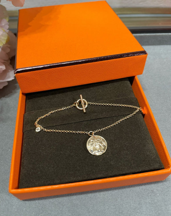 BRACCIALE CON MONETE HM