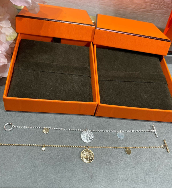 BRACCIALE CON MONETE HM