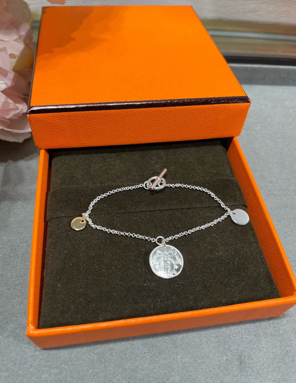 BRACCIALE CON MONETE HM