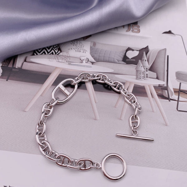 BRACCIALE CON LETTERA H OVALE IN ARGENTO CON NASO DI MAIALE