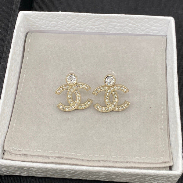 Boucles d'oreilles pendantes Chanel CC Cristal Doré