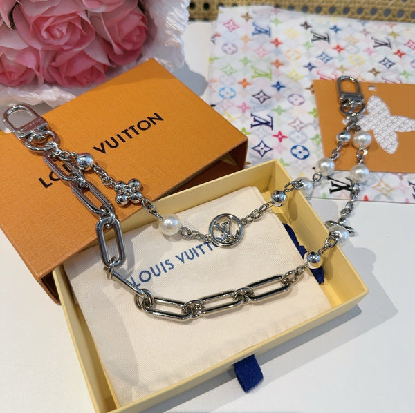 LV Figaro Charm Lustrous Brass