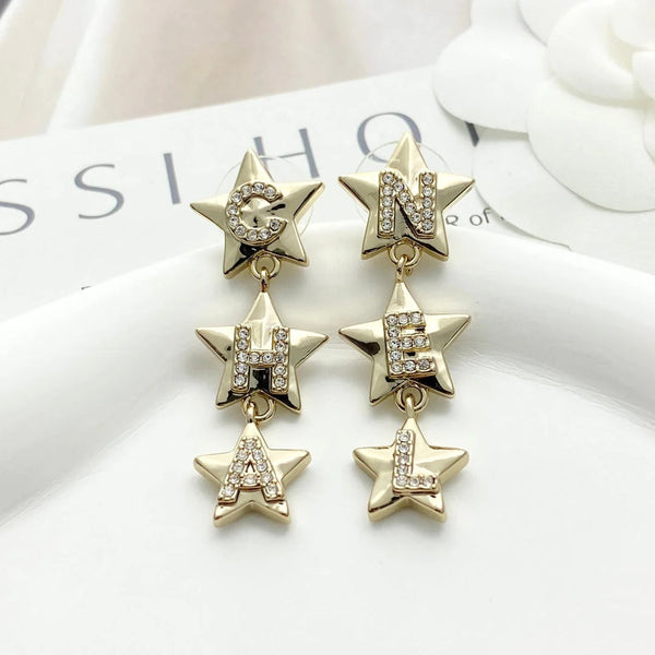 Boucles d'oreilles CC Double C 3 étoiles or clair