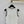 Chanel 2026 Gilet en laine blanc et noir avec logo brodé 364271