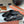 MULES PLATES EN CUIR DE VEAU NOIR GRAIN SERPENT