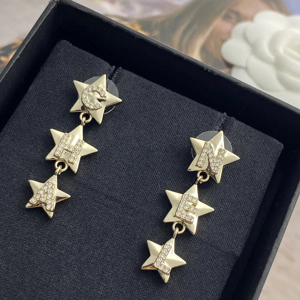 Boucles d'oreilles CC Double C 3 étoiles or clair