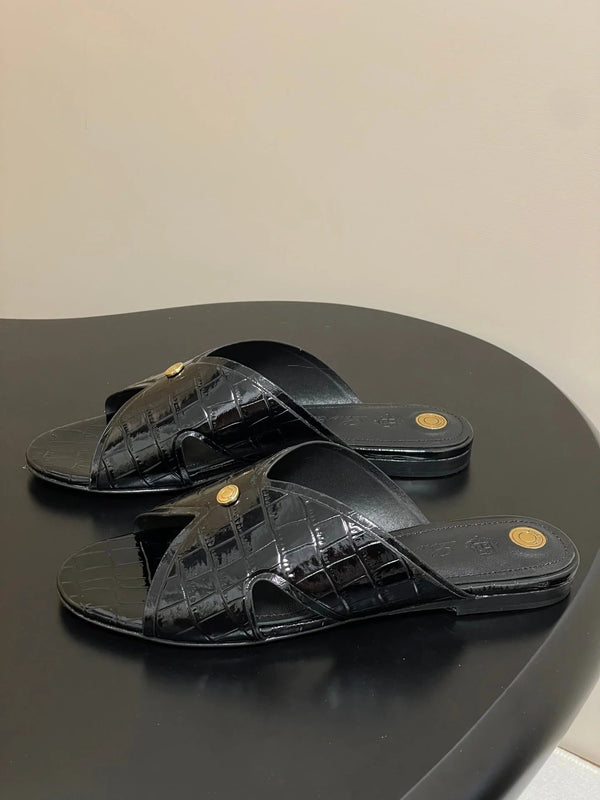 MULES PLATES EN CUIR DE VEAU NOIR GRAIN SERPENT