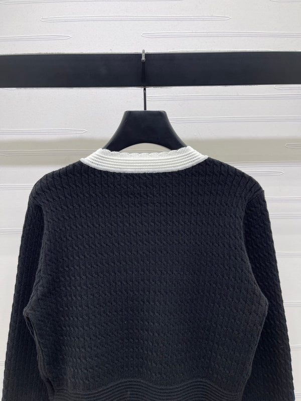 Chanel 25 Cardigan Laine noire mélangée blanche 321300