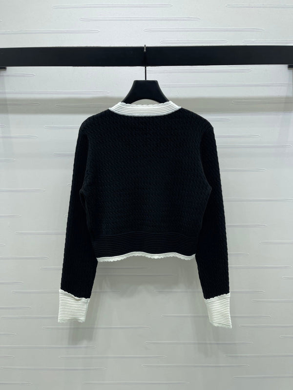Chanel 25 Cardigan Laine noire mélangée blanche 321300