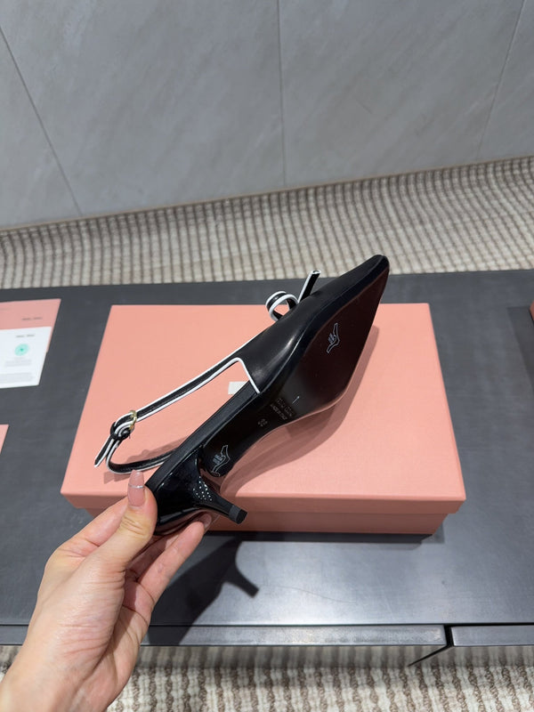 Miu 26s Slingback 55mm In Black White Calfskin With Bow