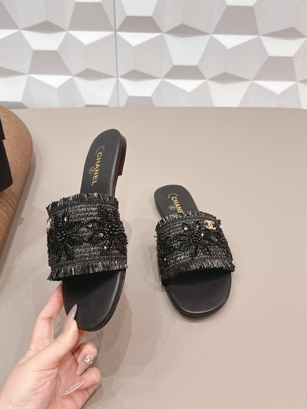 Sandales plates CC 26s en paille noire et cuir 613263