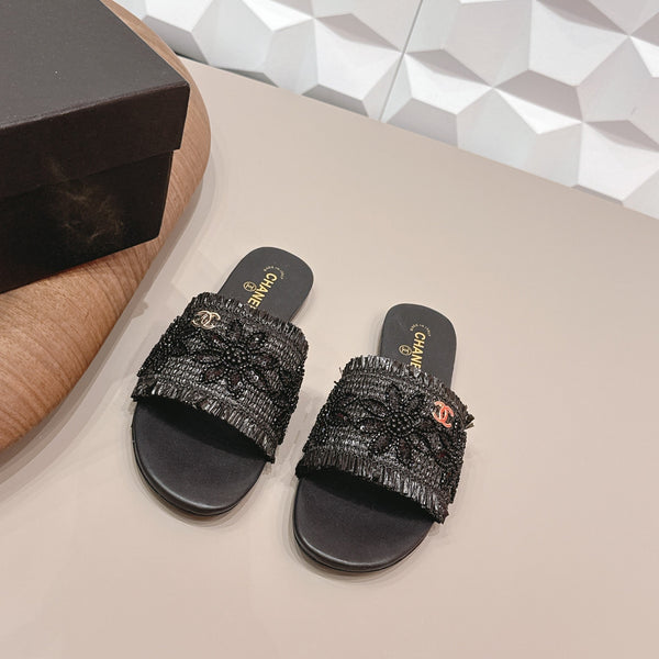 Sandales plates CC 26s en paille noire et cuir 613263