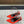 L'ENTRACTE SLINGBACK PUMPS IN RED SATIN